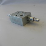 Anti-shock valve for snow plow blades