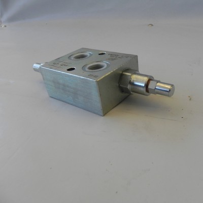 Anti-shock valve for snow plow blades