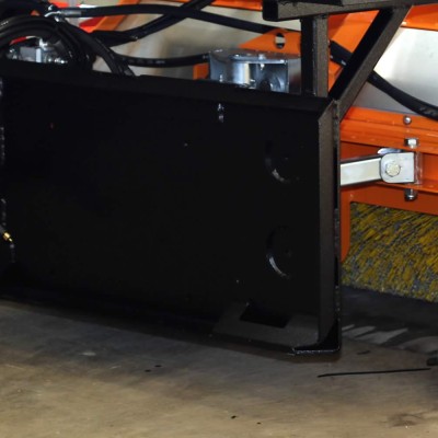 Skid loader hitch for SWC sweeper